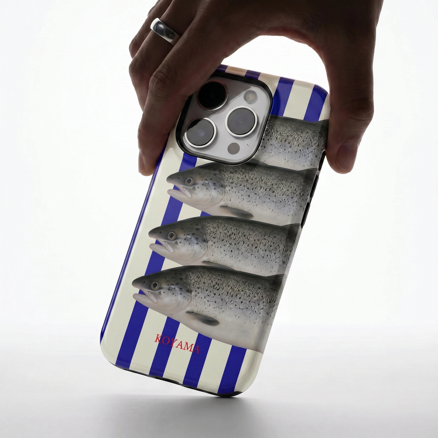 hand holding phone case with 4 fish